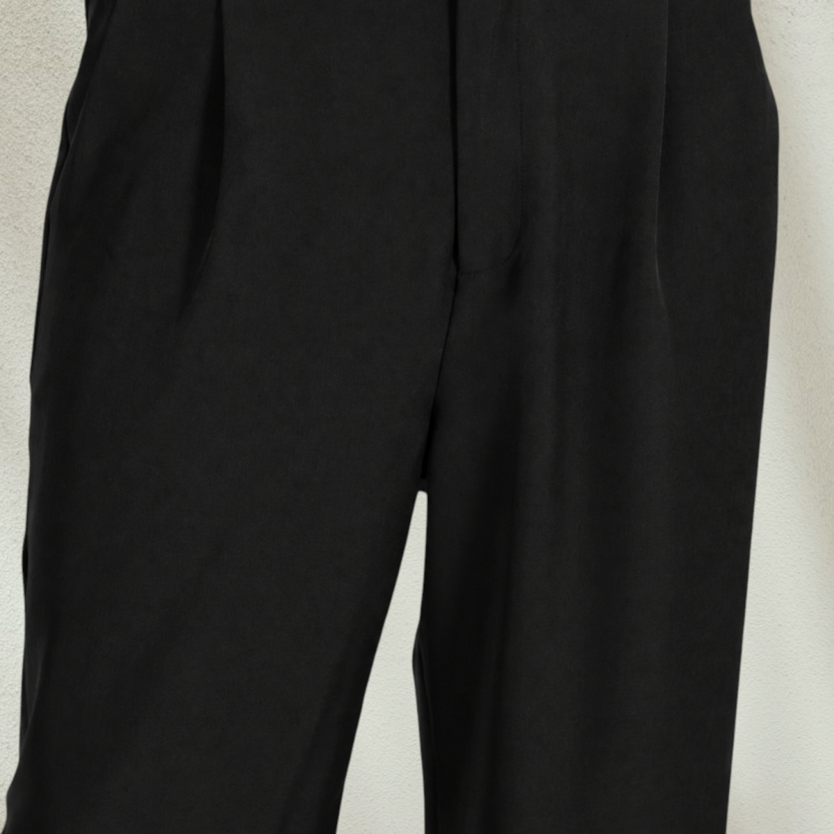 Purple Lola's Block black high-waisted wide-leg dress pants with a button closure and fluid tailored fit.