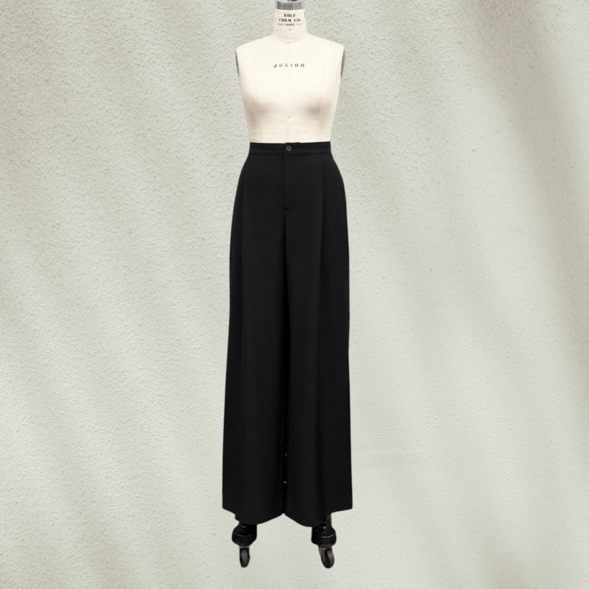 Purple Lola's Block Belinda high waist wide leg black dress pants on a mannequin in a studio setting.