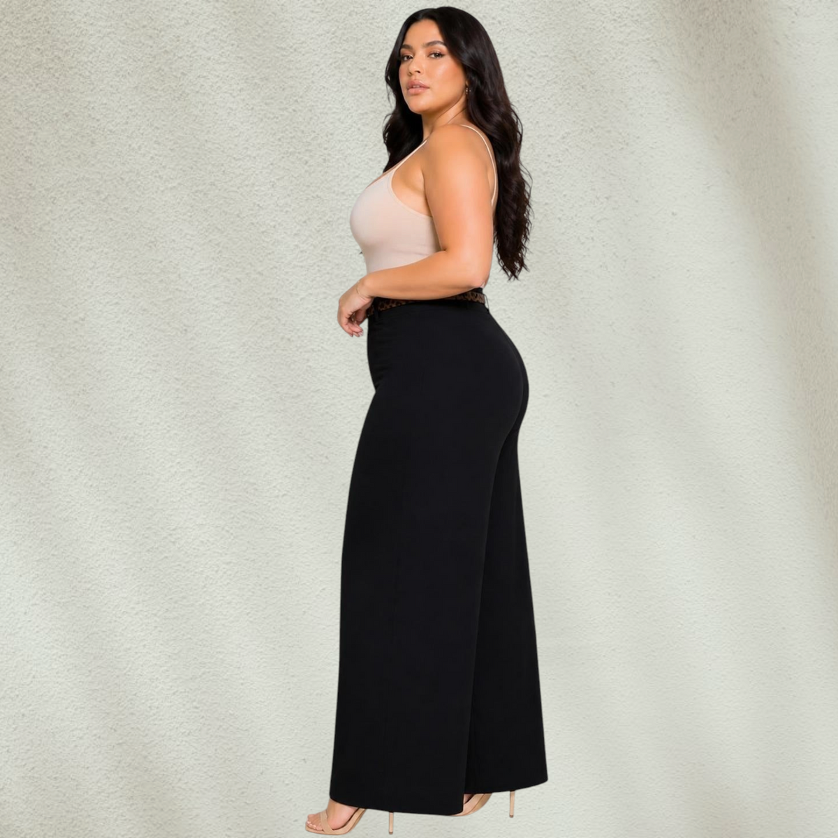 Purple Lola's Block black wide leg pants with animal print belt worn by a plus size model with a beige camisole.