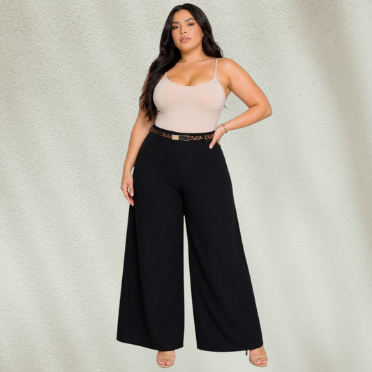 Purple Lola's Block plus size model wearing black wide leg pants with an animal print belt and beige camisole